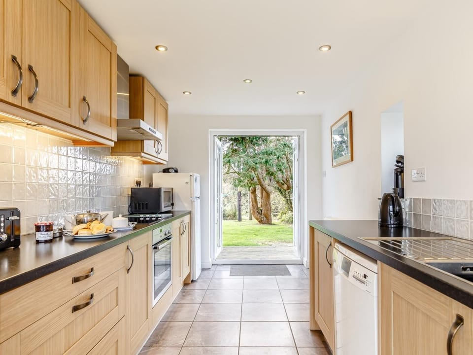 The kitchen has everything you need and leads out to the garden