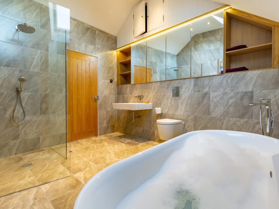 Bathroom with bath and shower