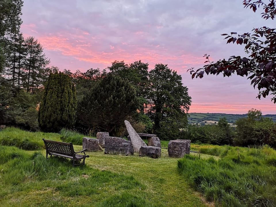 Relax with a drink beside the stone circle and enjoy sundowners