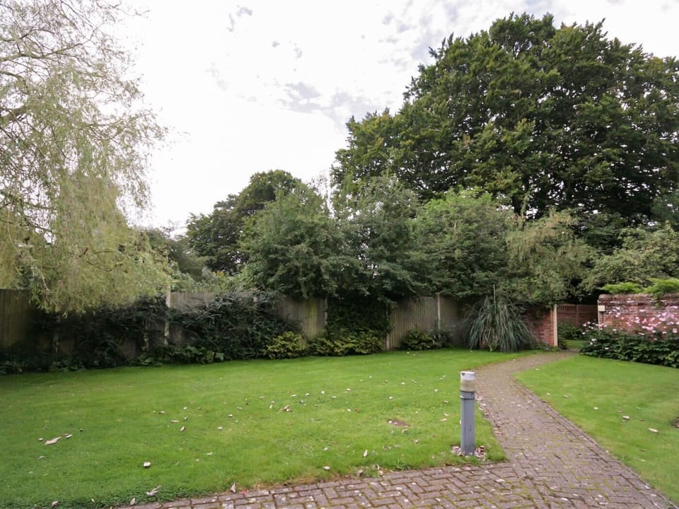 Shared lawned area with views across to the pretty village church