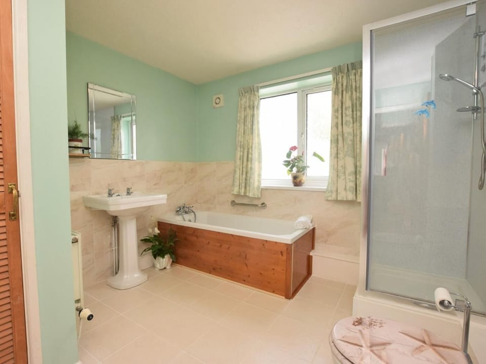 Ground floor family bathroom with bath, separate shower and WC