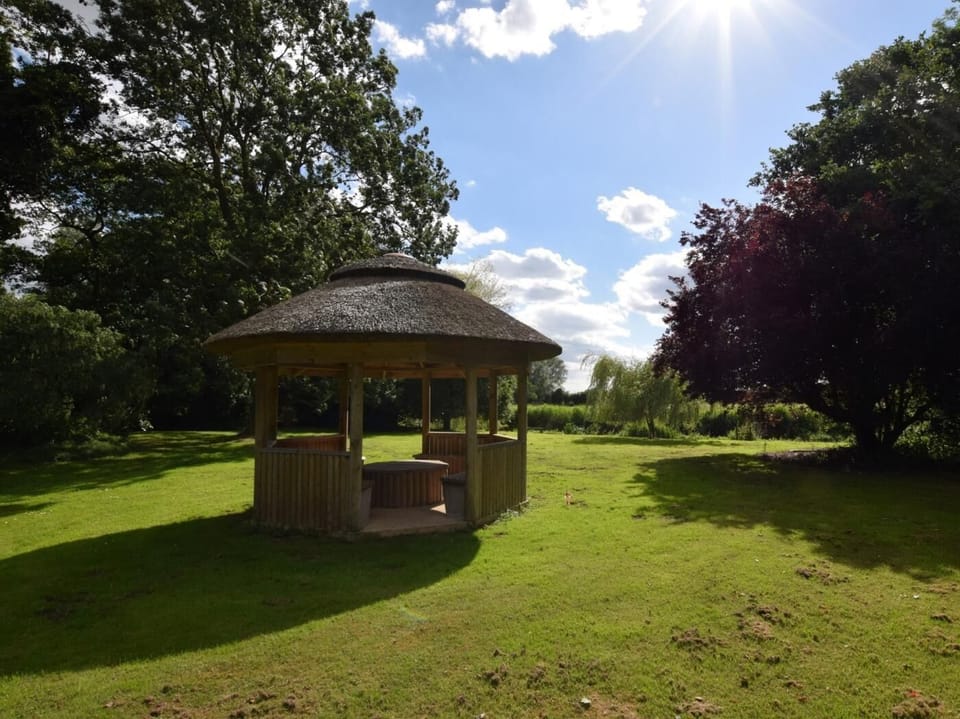 The gazebo provides a perfect picnic spot by the river