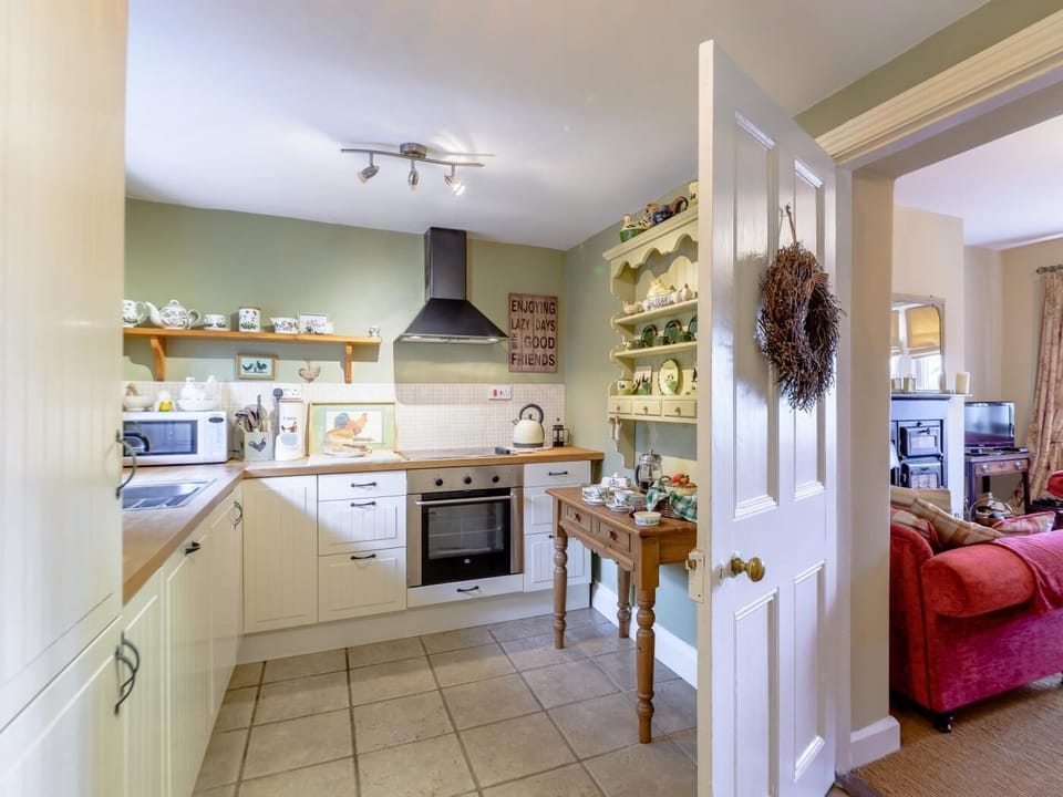 A cosy bright kitchen next to the lounge, making a great social space