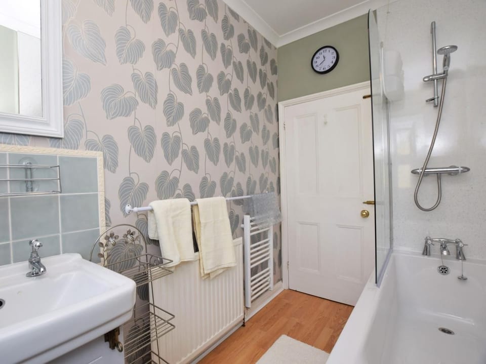 Bathroom with shower over bath
