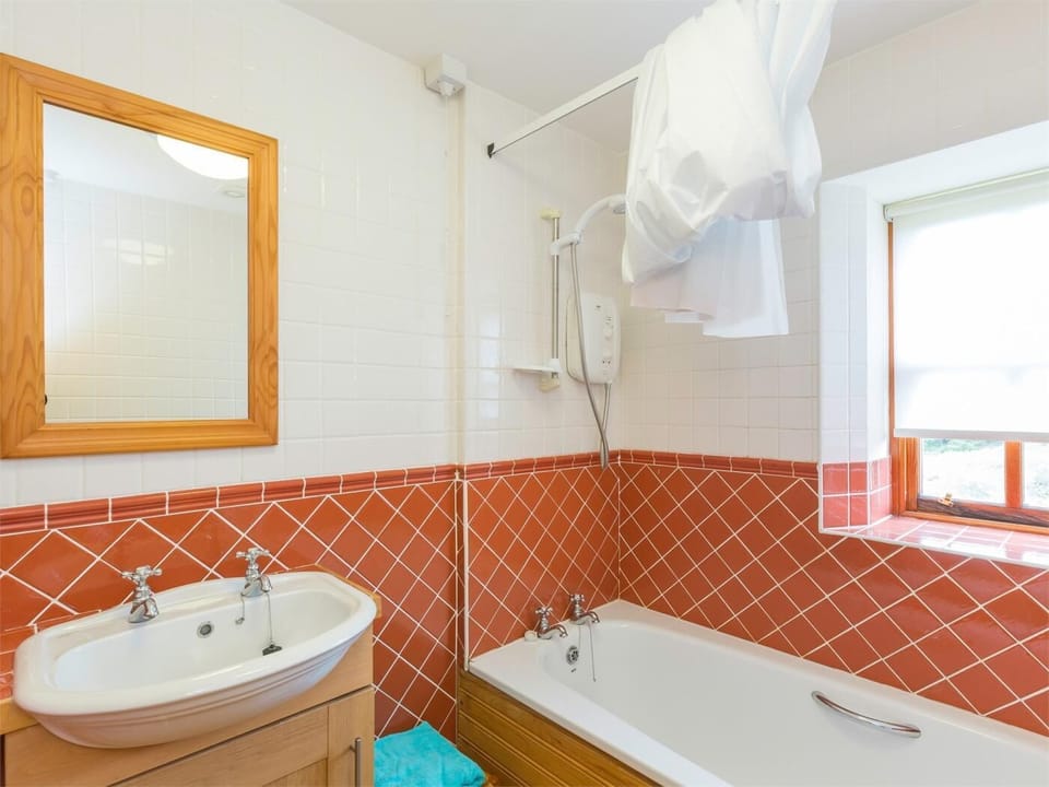 Bathroom with shower over