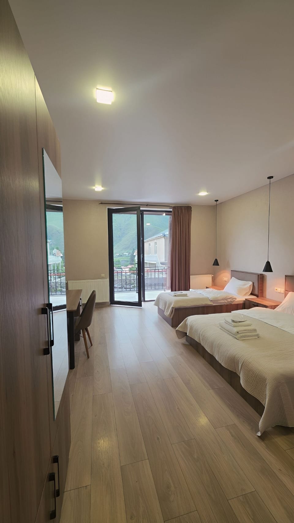 Comfort Triple Room, Balcony, Mountain View | Desk, laptop workspace, bed sheets