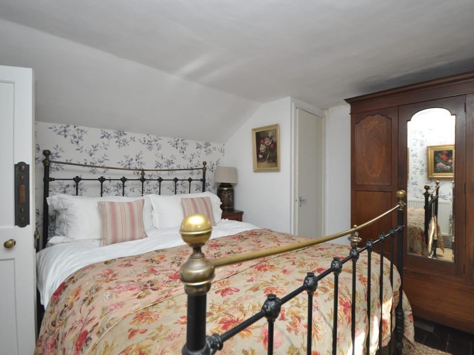 A beautiful double bedroom with garden views