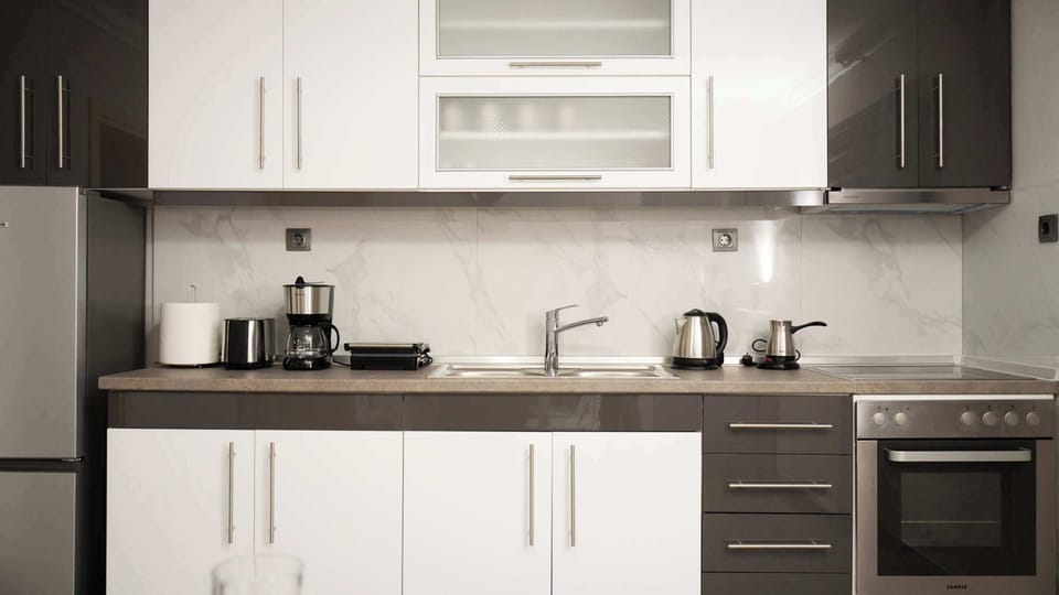 Spacious modern kitchen with ample preparation and storage space.