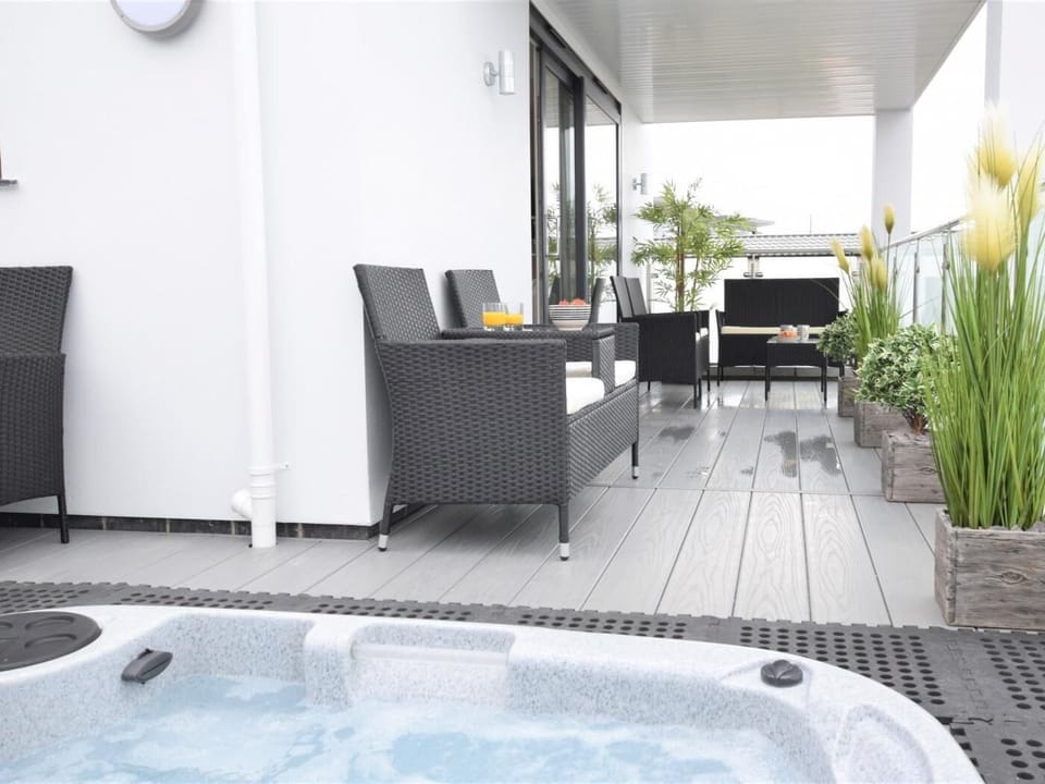 Balcony seating area with hot tub