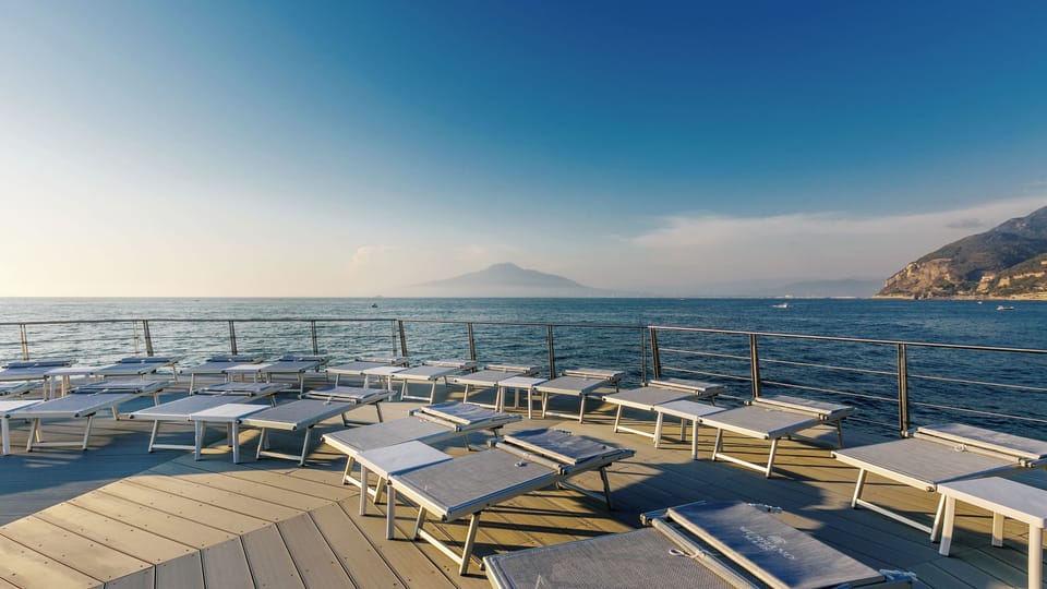 Private beach, black sand, sun loungers, beach towels