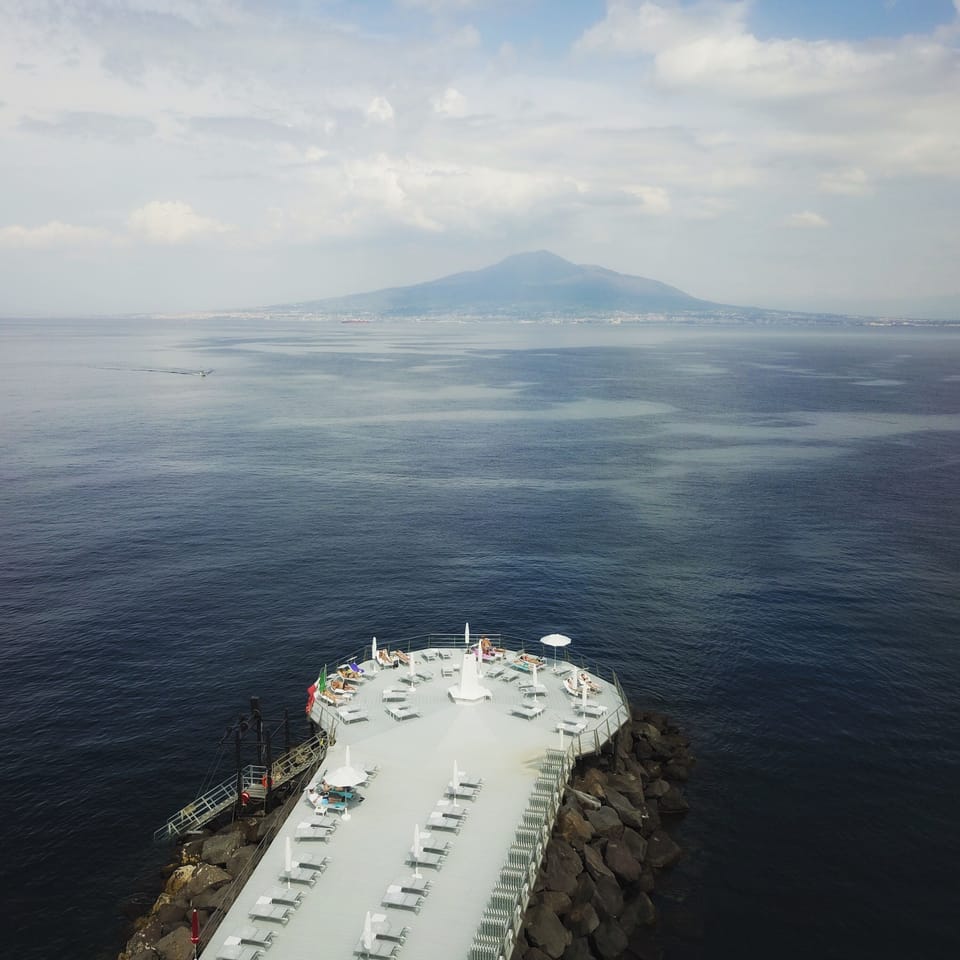 Private beach, black sand, sun loungers, beach towels