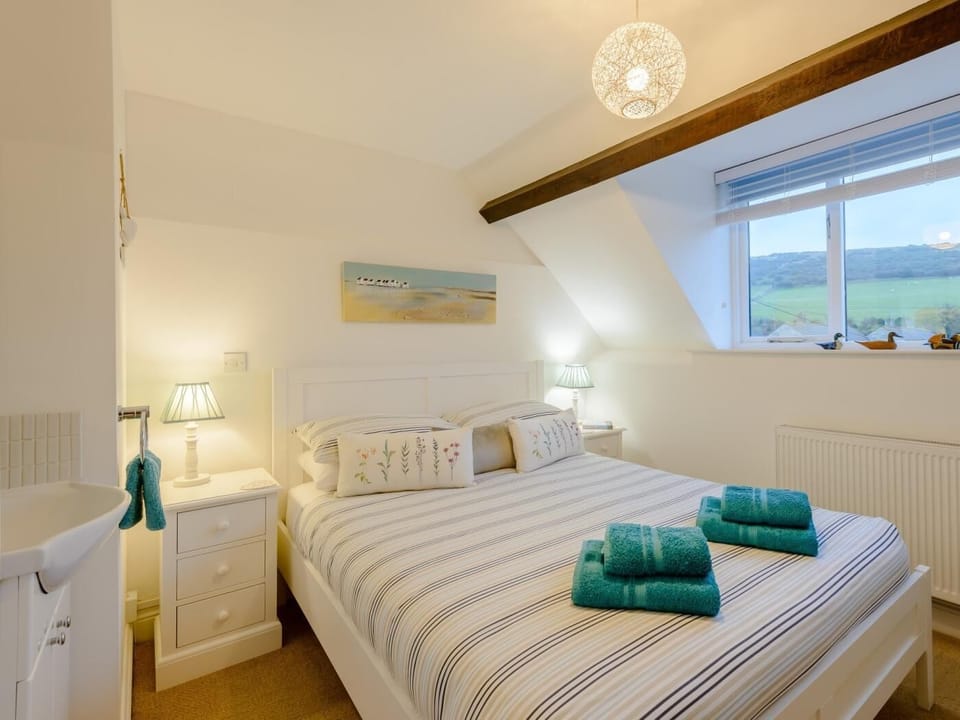 Comfortable king-size bedroom with basin