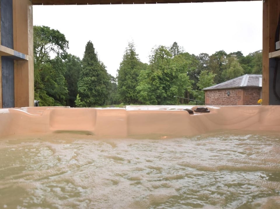 Relax and unwind in the fantastic hot tub and enjoy the lovely views