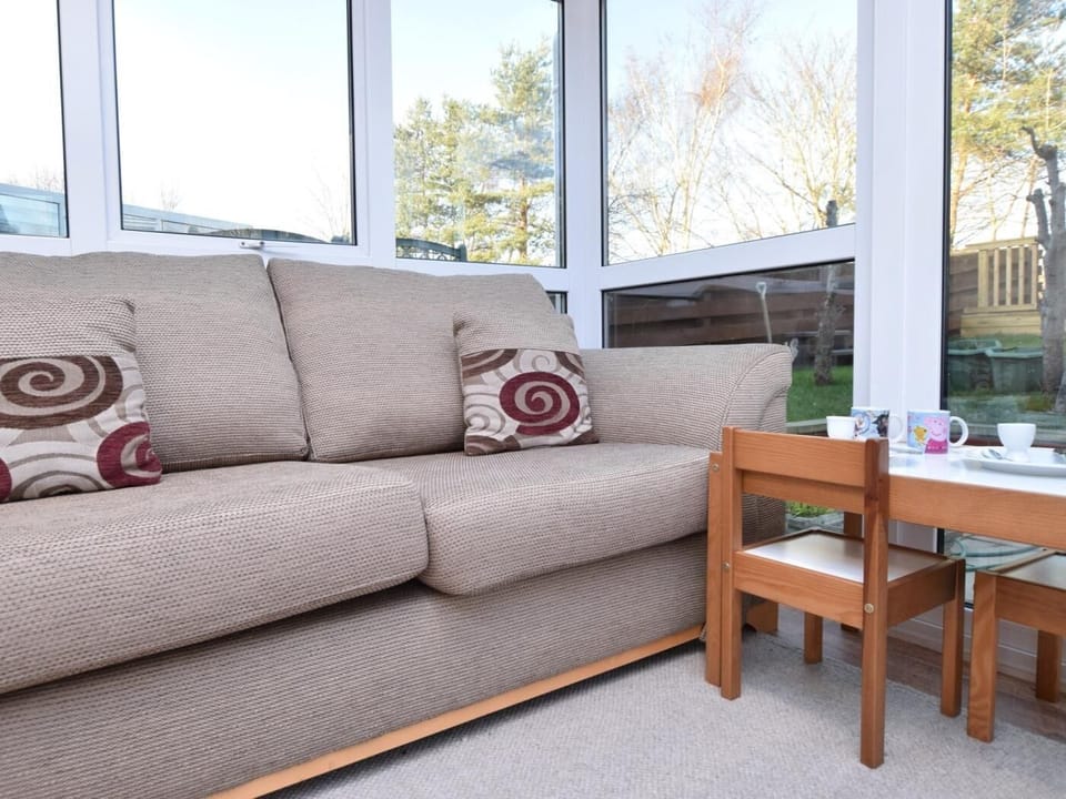 Relax in the sun room with direct access out to the garden with hot tub