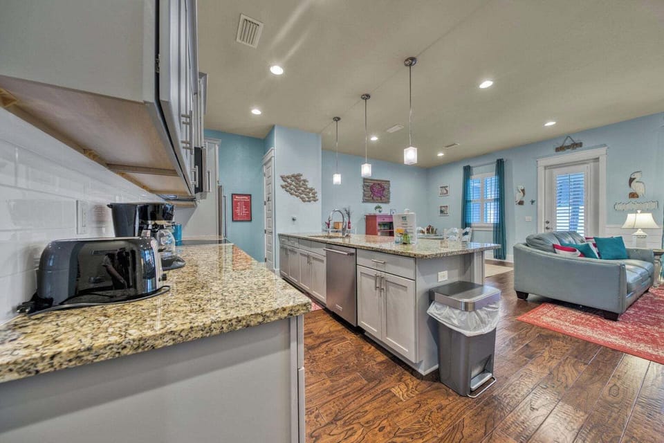 This bright, open-concept space seamlessly blends your gourmet kitchen and cozy living area. Cook with granite counters and stainless appliances while staying connected to relaxation areas bathed in natural light.