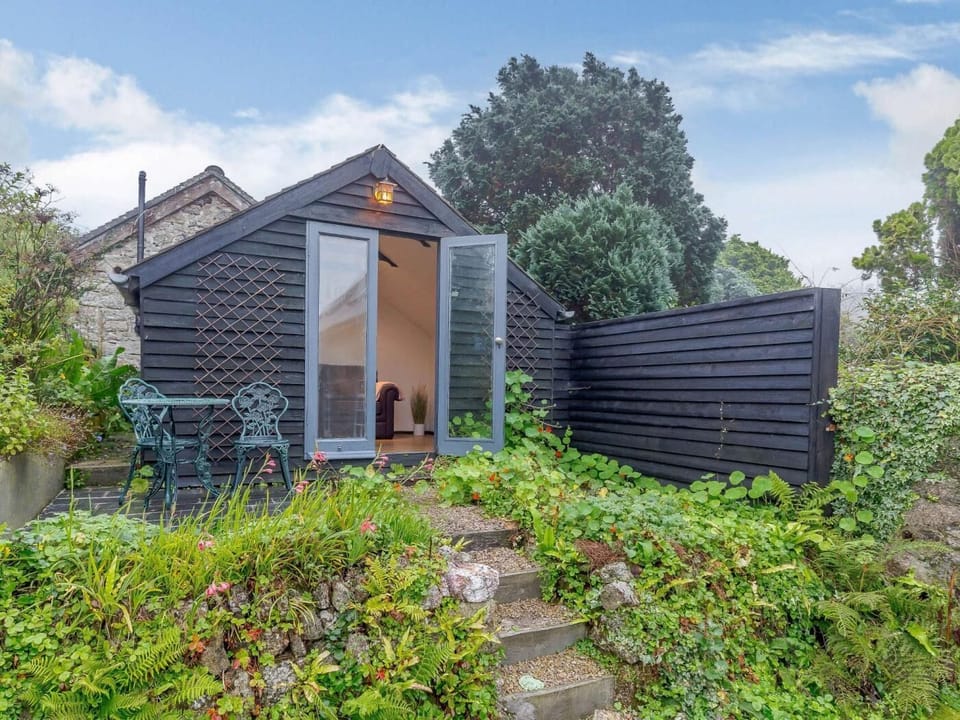 The summer house provides the perfect space for curling up with a book