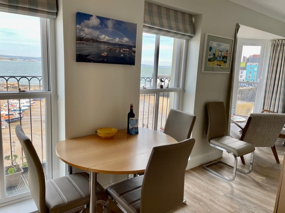 The open plan lounge/kitchen.diner has stunning view of Tenby Harbour
