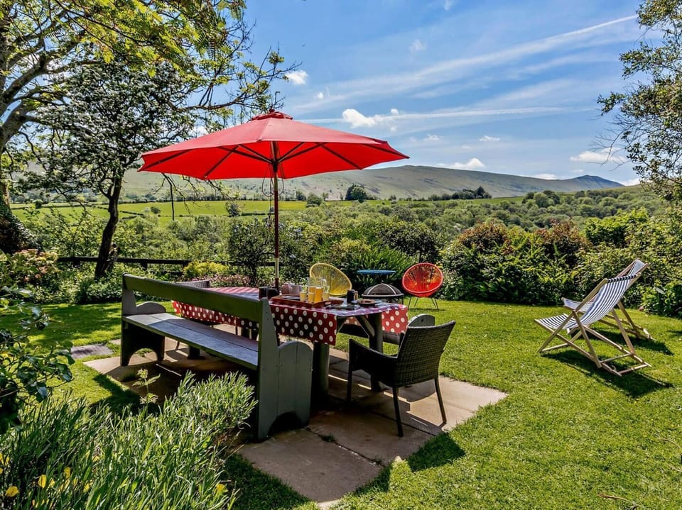 Far-reaching views of the Brecon Beacons from the garden areas