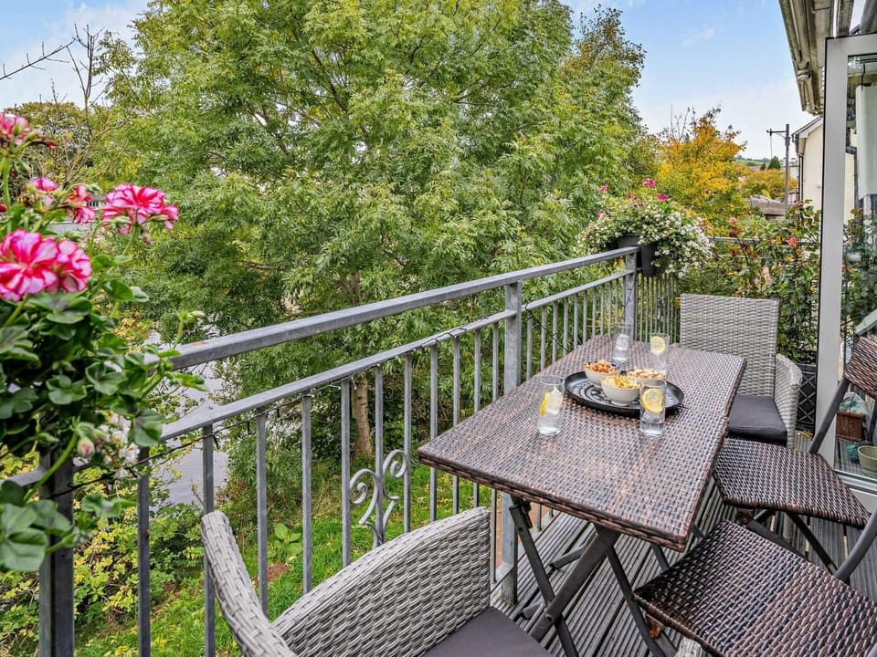 The balcony is the perfect spot for morning coffee and evening drinks