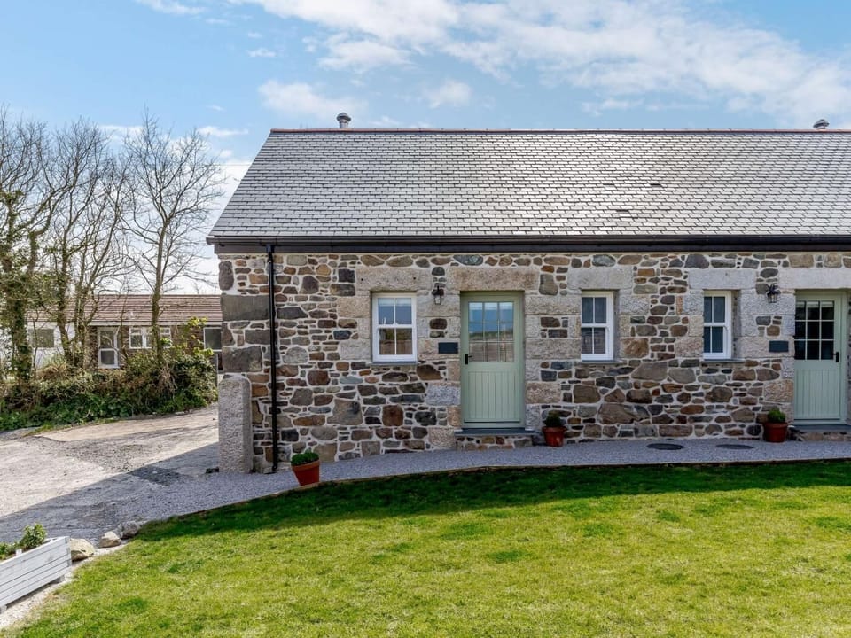 The approach to the cottage, nestled in a rural location