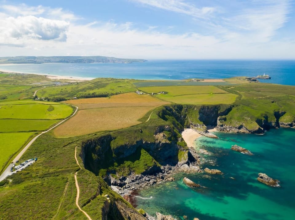 Drive alone the coast next to Hell's Mouth on your way to Gwithian and Godrevy beaches