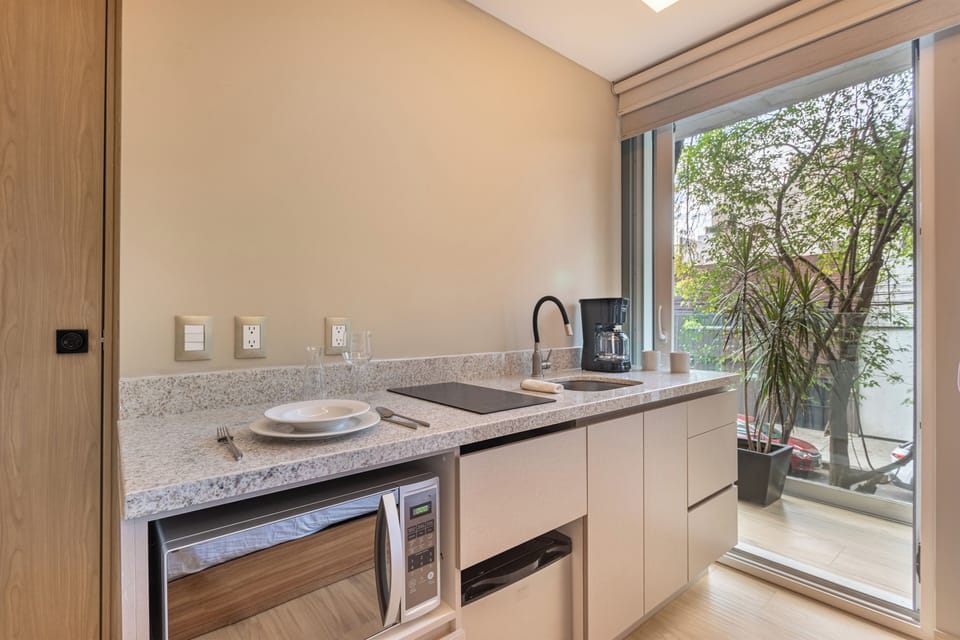 Superior Studio Suite, Kitchenette | Private kitchen | Mini-fridge, microwave, stovetop, cookware/dishes/utensils