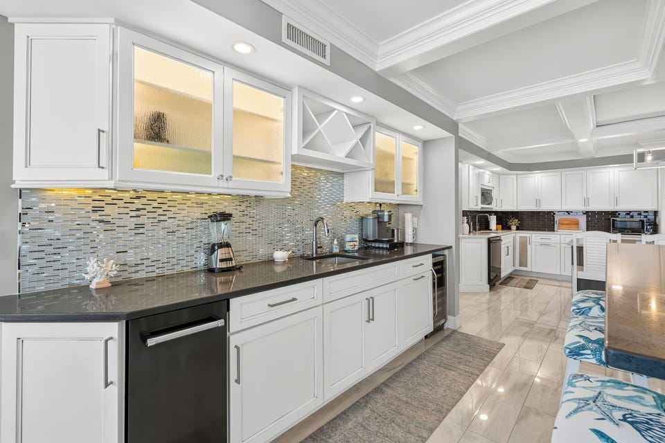 Full wet bar with wine refrigerator and ice maker freezer