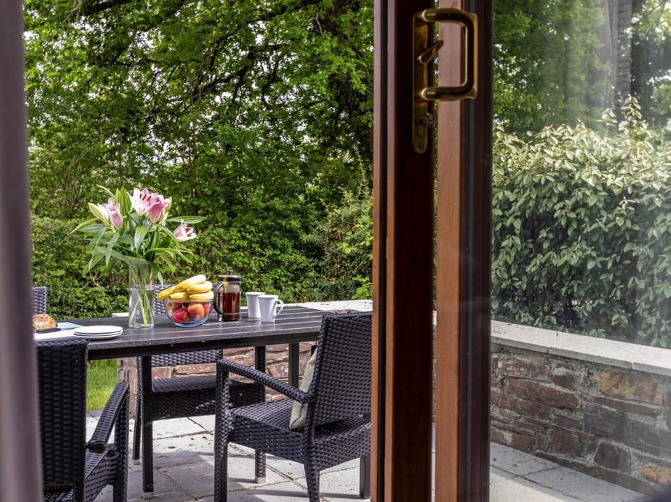 Step out from the lounge to the garden dining area