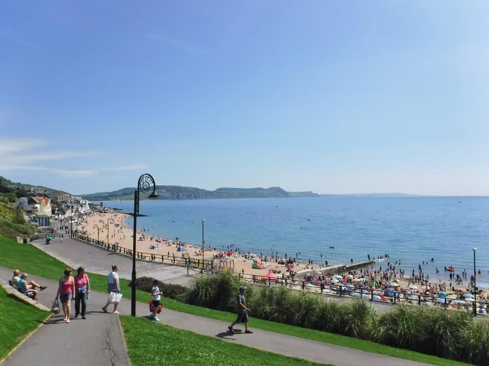 Walk along the seafront promenade in Lyme Regis