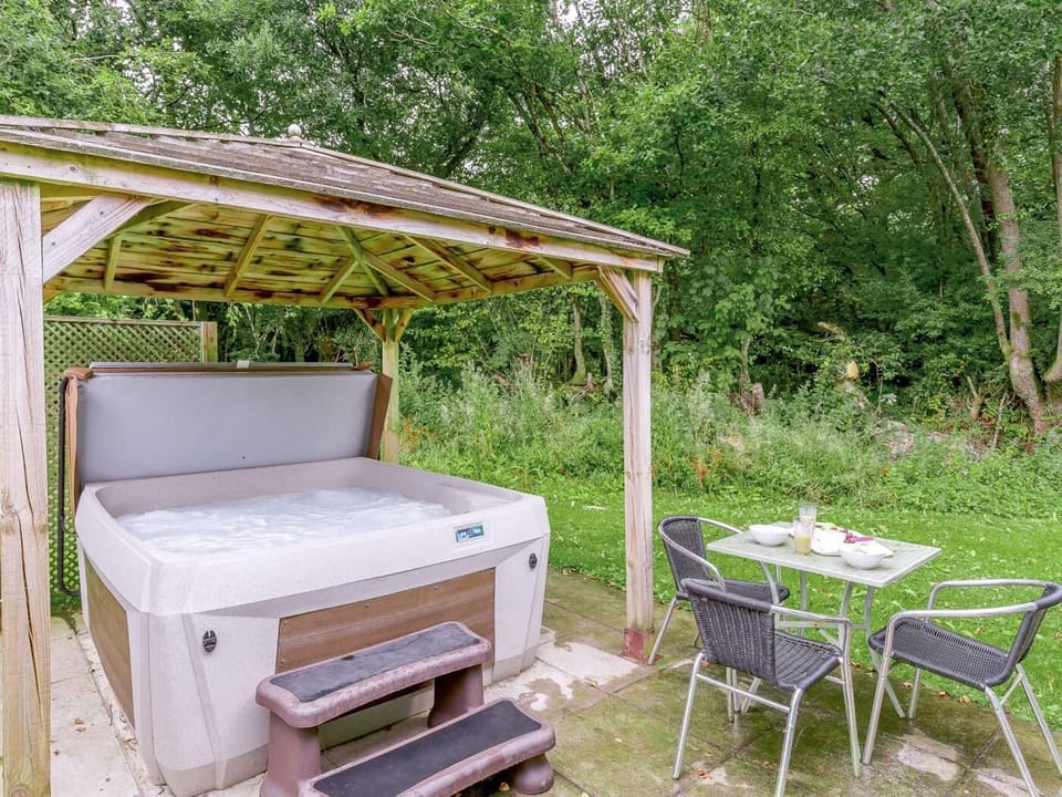 Private, covered hot tub within pretty garden