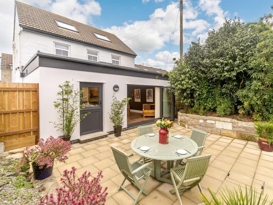 Bi fold doors open out into the lovely outside space of this stylish property