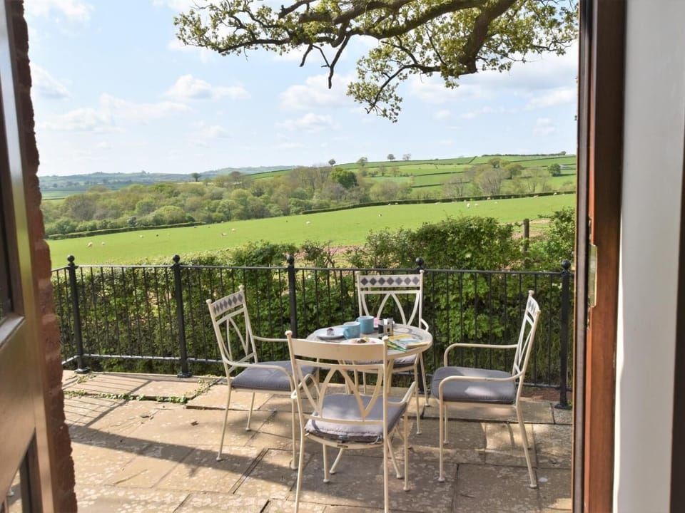 The terrace with patio table and seating