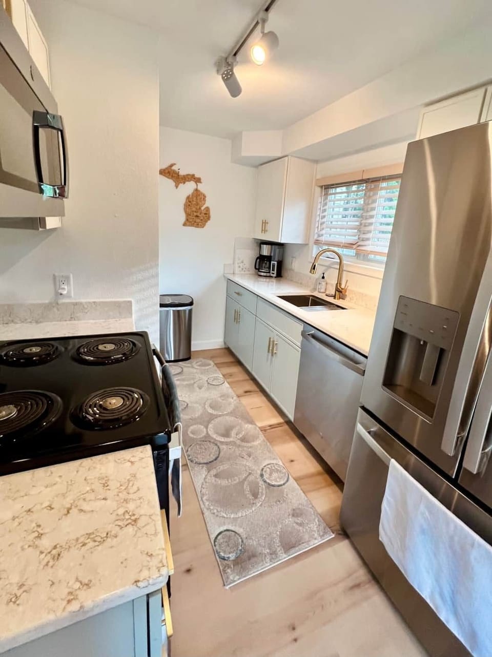 Fully stocked galley kitchen with all new appliances. 