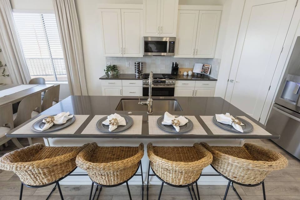 Kitchen island with sink and seating for four. Perfect for casual meals or gathering together!