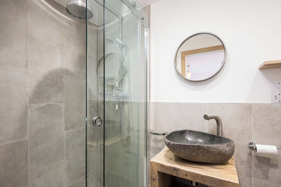 Contemporary & unique fittings in this lovely shower room