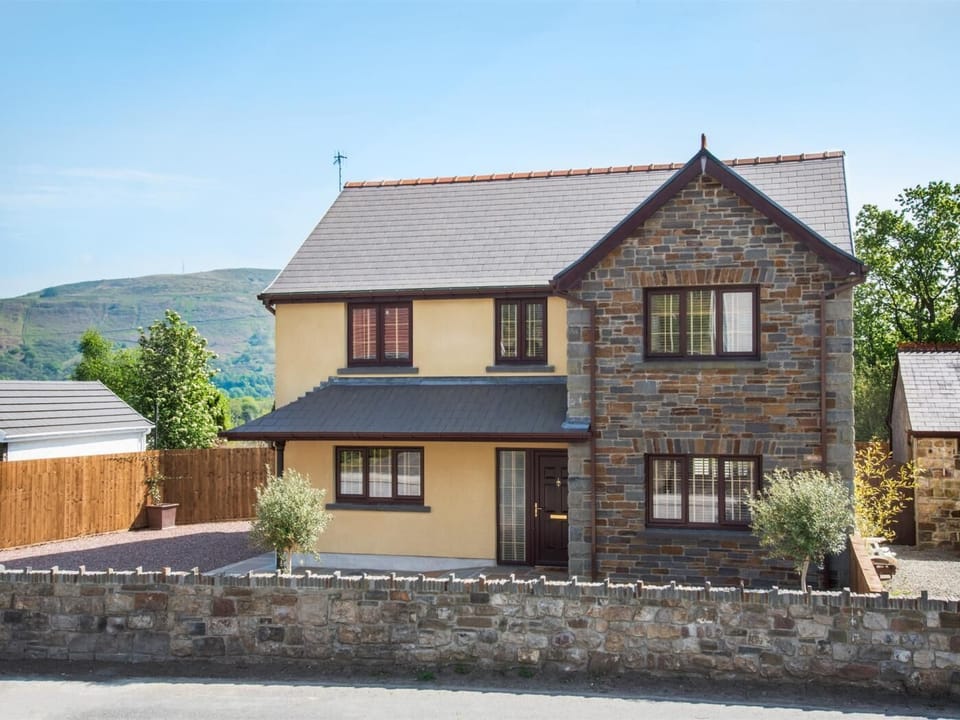 A modern home with views of the surrounding valleys and is close to all main services