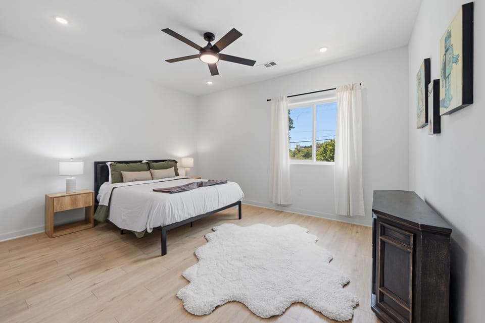 Bedroom 2 (Primary) w/ queen bed & ensuite bath