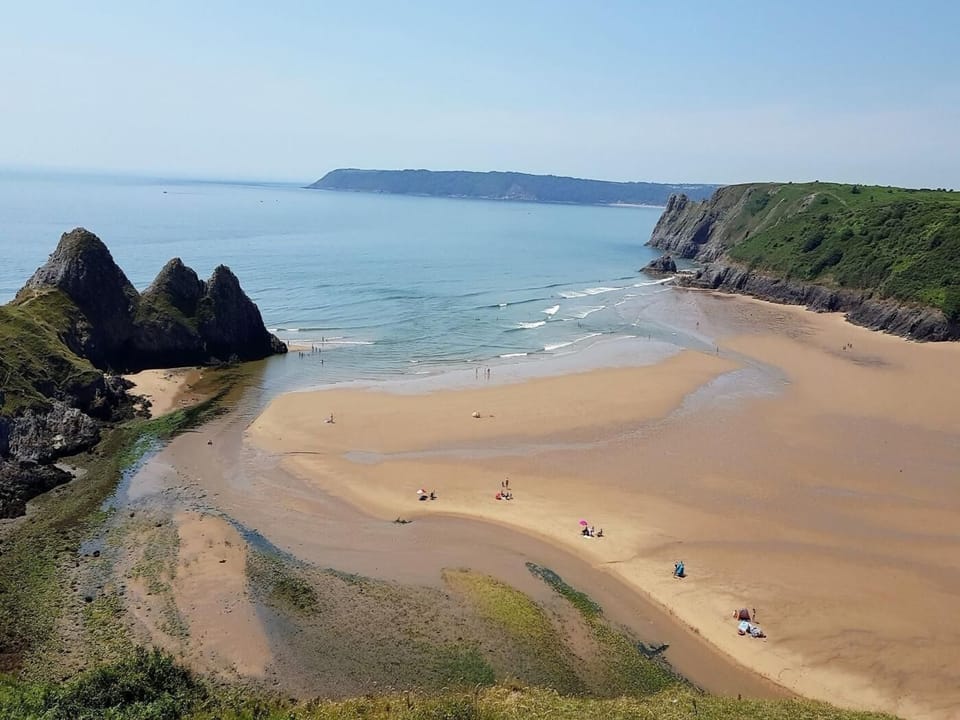 Explore Three Cliffs Bay with its wonderful views and meandering river
