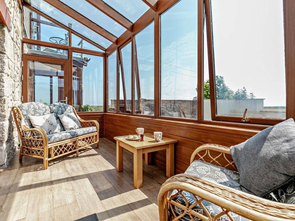 The sun room is a lovely peaceful place to enjoy a good book