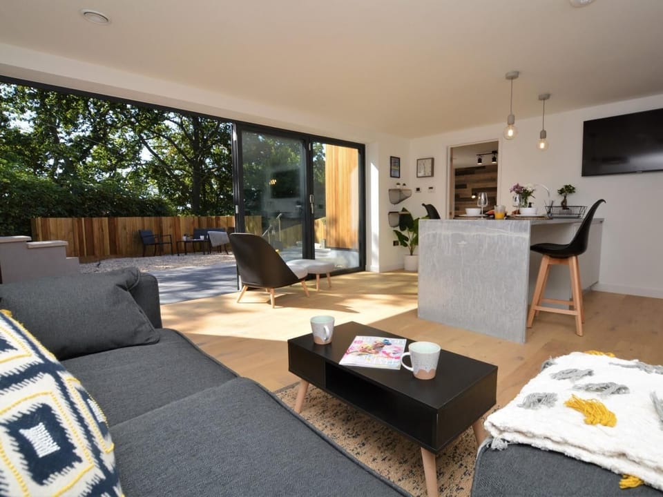 Light and airy lounge/kitchen/diner with bi-folding doors opening on to the patio