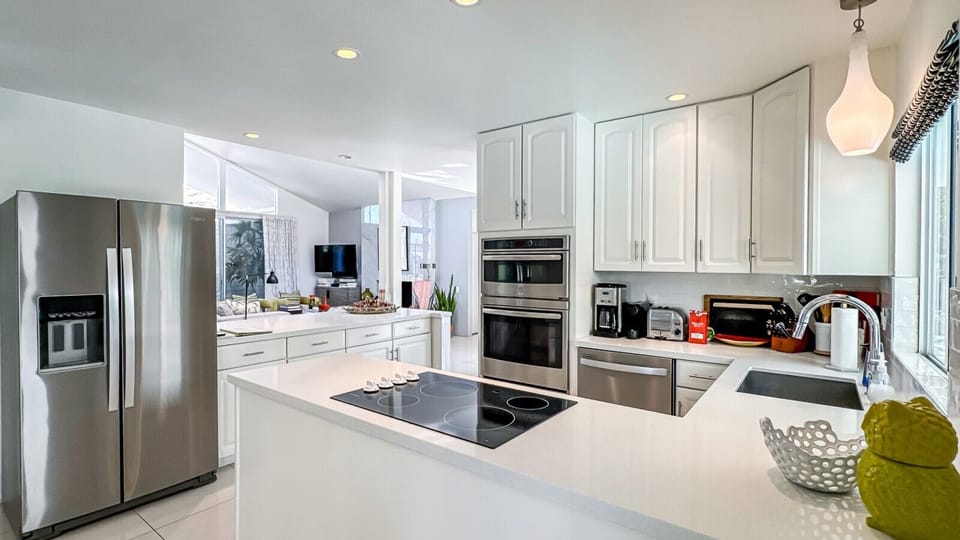 Full Kitchen Overlooks Pool and Mountains