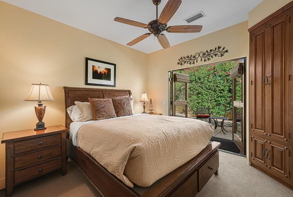 Guest Bedroom Three has Queen Bed and Furnished Patio