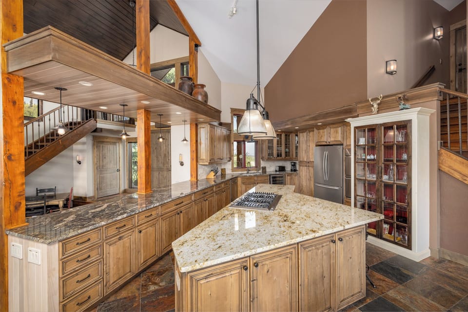 Large kitchen with ample counter space on the island to prep family meals | Main Level
