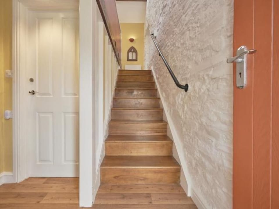 The stairs lead up to the main living area