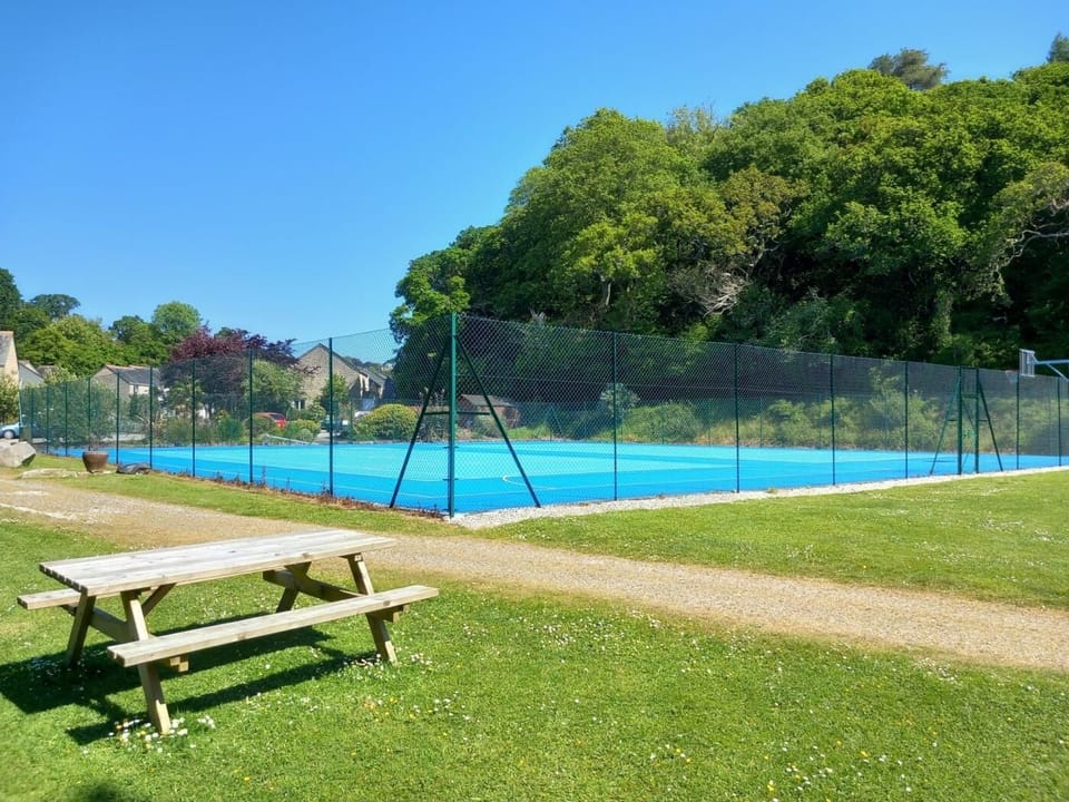 Recently upgraded tennis courts for guest use.