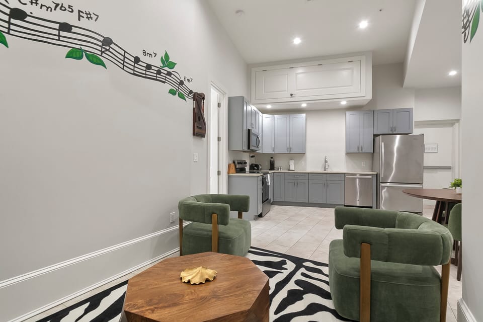 Deluxe Suite | Living area | 42-inch flat-screen TV with digital channels