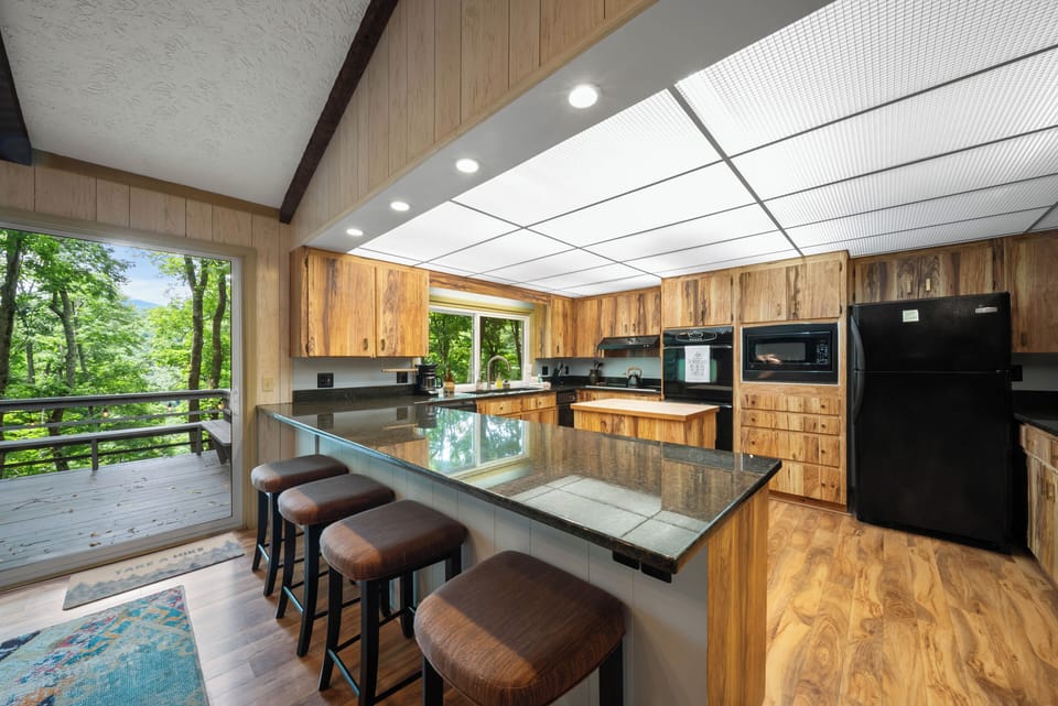 Beautiful Wood Kitchen with Bar Seating, Deck Access, and a Peek at Grandfather Mountain