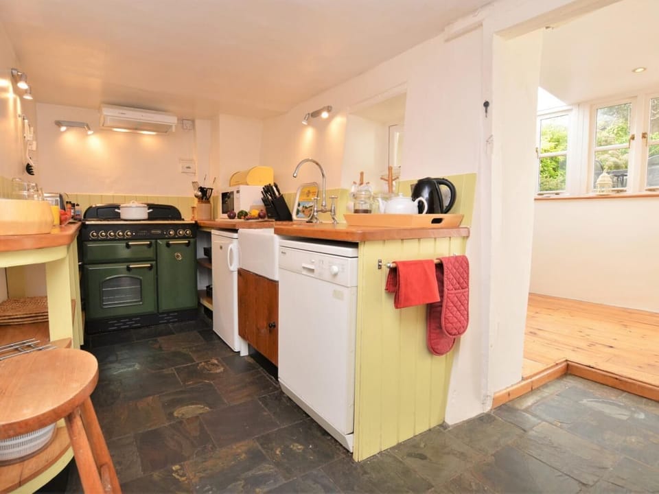 A step up from the kitchen leads to the conservatory