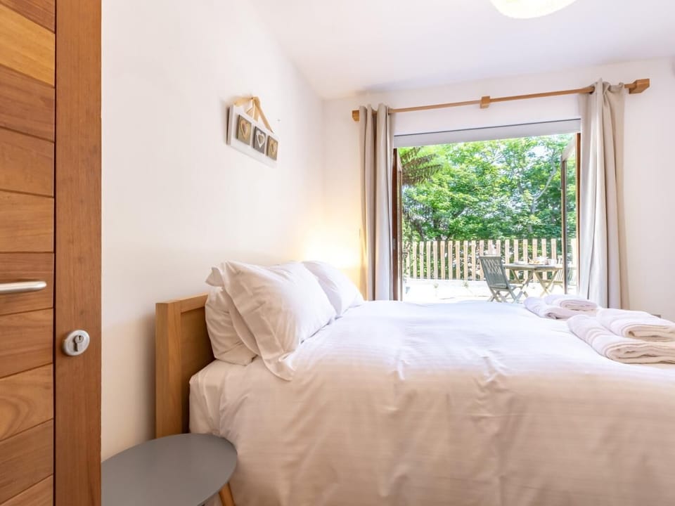 Downstairs king-size bedroom with access to patio