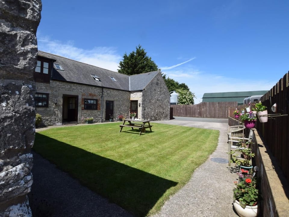 End section of beautiful barn conversion with shared courtyard garden